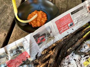 Romesco sauce with calçot being dipped